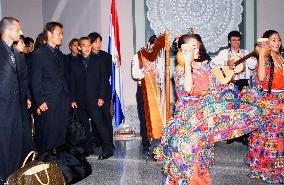 Japan's soccer team greeted by Paraguayan dancers